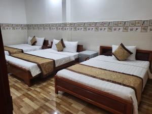 Postel nebo postele na pokoji v ubytování Sơn Tùng Motel