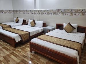 Postel nebo postele na pokoji v ubytování Sơn Tùng Motel