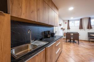 a kitchen with a sink and a counter top at mountain view in Piesendorf