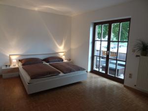 
Ein Bett oder Betten in einem Zimmer der Unterkunft Ferienhaus van Vliet
