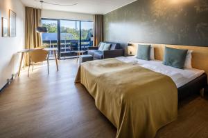 Voodi või voodid majutusasutuse Fjordgaarden - Spa - Hotel - Konference toas