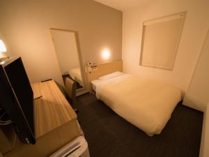 Postel nebo postele na pokoji v ubytování Super Hotel Kitami