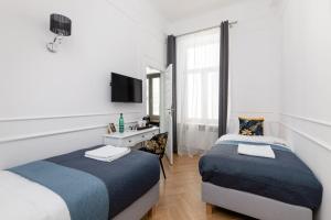 Posteľ alebo postele v izbe v ubytovaní Lwowska 9 - Cozy & Comfortable Studio by Noclegi Renters
