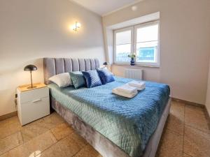 Apartamenty na Wyspie - Stella Baltic - Parking tesisinde bir odada yatak veya yataklar