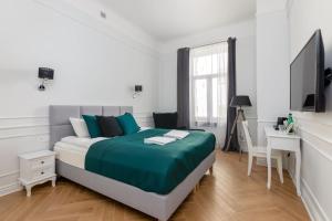 Posteľ alebo postele v izbe v ubytovaní Lwowska 9 - Cozy & Comfortable Studio by Noclegi Renters