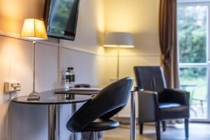 TV a/nebo společenská místnost v ubytování Hotel Tønderhus