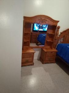 a bedroom with a large mirror and a bed at Hunts Point Short Stays in Hunts Point