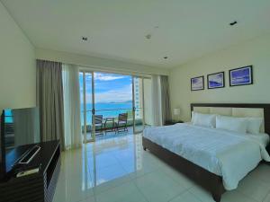 a bedroom with a bed and a view of the ocean at Sea View Luxury - Apartments in Nha Trang +118 photos