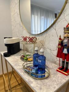 a table with two bottles of water and a mirror at EXPLANADA BEACH FLAT in Alicante