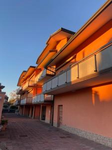 a building with balconies on the side of it at Adria Residence in Gatteo a Mare