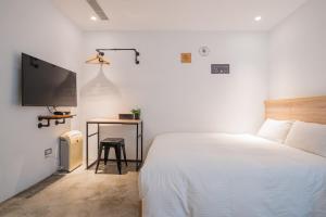 Ένα ή περισσότερα κρεβάτια σε δωμάτιο στο CHASE Hotel