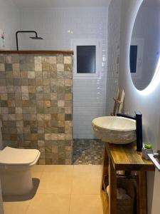 a bathroom with a sink and a toilet at La Casa Azul in Maspujols