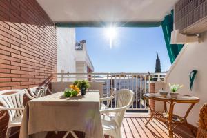 a patio with a table and chairs on a balcony at Apartamentos Atlas IV in Salou