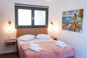 Postel nebo postele na pokoji v ubytování Serenity Luxe Suites