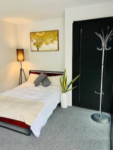 a bedroom with a bed with a plant on it at East Bridgford Summerhouse Inc Spa and Treatments in East Bridgford
