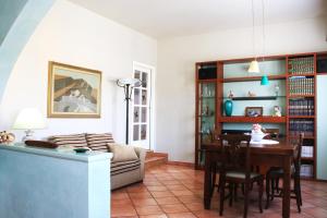 a living room with a table and a couch at La casa di Jacopo [Intero appartamento+parcheggio] in Pistoia