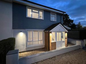 a house with a door with lights on it at Immaculate Newly Refurbished 4 Bed House in Nottingham