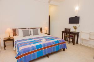Ένα ή περισσότερα κρεβάτια σε δωμάτιο στο Hotel Vibration