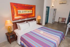 Ένα ή περισσότερα κρεβάτια σε δωμάτιο στο Hotel Vibration