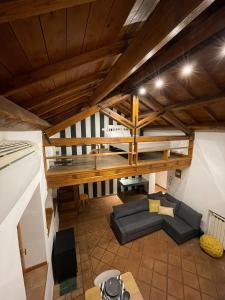 an overhead view of a living room with a loft at Lo Chalet di Ponte Milvio - Auditorium - Foro Italico - Stadio Olimpico in Rome