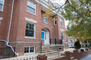 a brick house with a blue door and stairs at Dupont Circle 1br w wd nr bars metro station WDC-750 in Washington, D.C.