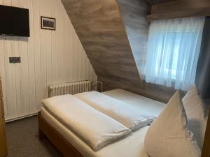 Postel nebo postele na pokoji v ubytování Penzion Logla