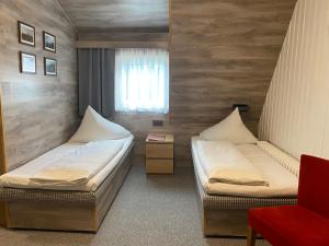 Postel nebo postele na pokoji v ubytování Penzion Logla