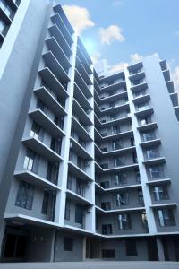 an apartment building with balconies on the side at Axon Aleta in Mumbai