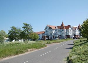 a large building on the side of a road at 14 Links Way in West Runton