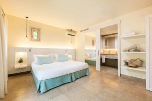 Voodi või voodid majutusasutuse Hotel Sa Franquesa Nova toas