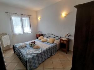 Ένα ή περισσότερα κρεβάτια σε δωμάτιο στο Piccolo Residence vicino alla spiaggia con bellissima vista mare