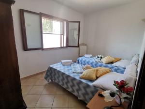 Ένα ή περισσότερα κρεβάτια σε δωμάτιο στο Piccolo Residence vicino alla spiaggia con bellissima vista mare +35 φωτογραφίες