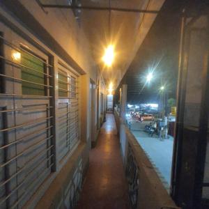 an empty hallway of a building at night at Hotel Family Stay in Aurangabad