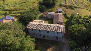 an aerial view of a house in a field at Casa Vespina Agriturismo Biologico in Orvieto