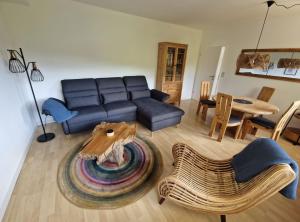 a living room with a couch and a table at Ferienwohnung Ruthenaar in Willingen