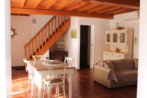a living room with a table and a couch at Les Gîtes de Genas in Bourg-lès-Valence