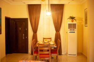 a dining room with a table and chairs at ChallawaRiver Homes in Calabar