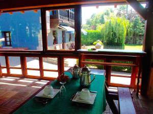 a table in a room with a view of a window at Villalen in Cuerres