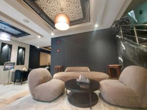 Posezení v ubytování Cadé Hotel