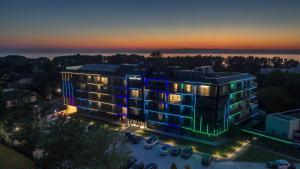 an aerial view of a building with lights on at Imperiall Resort&MediSPA-DOMKI PREMIUM in Sianozety