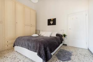 En eller flere senge i et værelse på Casa Gin Tonic