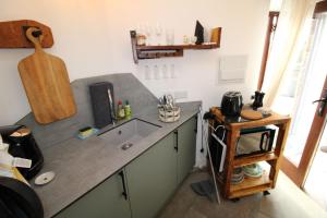 a kitchen with a sink and a counter top at The Beehive Warton in Warton