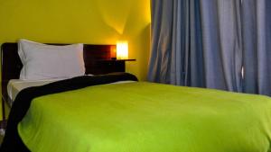 Een bed of bedden in een kamer bij Bela Sombra