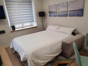 Łóżko lub łóżka w pokoju w obiekcie Apartamento Parras