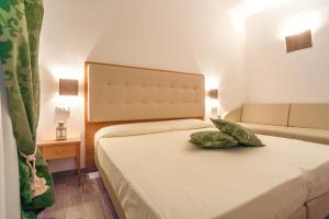 Postel nebo postele na pokoji v ubytování Hotel Il Buongustaio + 37 fotografií