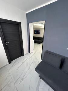 a living room with a couch and a door at LUIGI LUXURY SUITE in Naples +84 photos