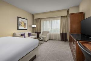 a hotel room with a bed and a television at DoubleTree by Hilton Chicago O'Hare Airport-Rosemont in Rosemont