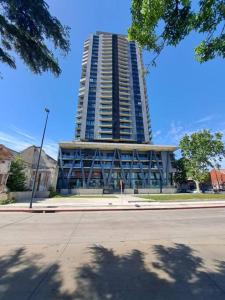 a tall building on a street in front of a building at 2 dormitorios, parking, ¡nuevo! in Montevideo