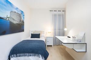 Posteľ alebo postele v izbe v ubytovaní Home2Book Design Apartment Residencial Anaga