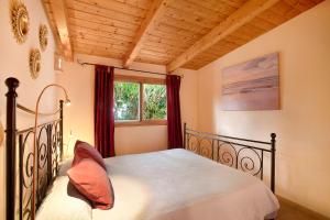 a bedroom with a bed and a window at Casa Anakena in Guía de Isora +20 photos